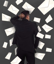 Email spam. Confused man and many letters on grey background