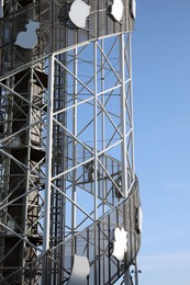 Photo of Structure of modern tower against blue sky