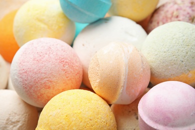 Photo of Many bath bombs as background, closeup view