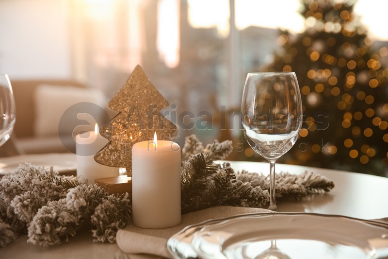 Elegant table setting with Christmas decor indoors