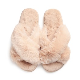 Pair of soft fluffy slippers on white background, top view