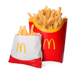 MYKOLAIV, UKRAINE - AUGUST 11, 2021: Big and small portions of McDonald's French fries on white background