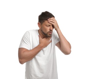 Man suffering from pain during breathing on white background