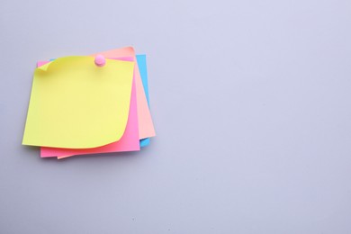 Photo of Paper notes on light purple background, top view. Space for text