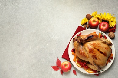Traditional cooked turkey and autumn decor on light table, flat lay with space for text. Thanksgiving day celebration