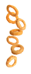 Fried onion rings falling on white background