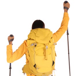 Female hiker with backpack and trekking poles on white background, back view