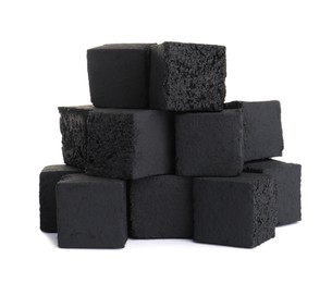 Stack of charcoal cubes for hookah on white background