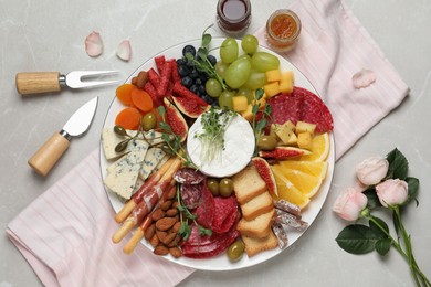 Photo of Set of different delicious appetizers served on light grey table, flat lay