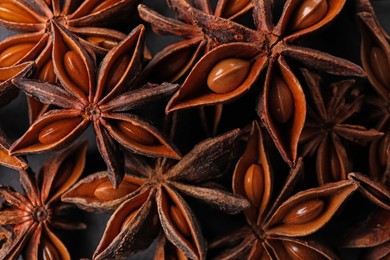Aromatic anise stars as background, top view