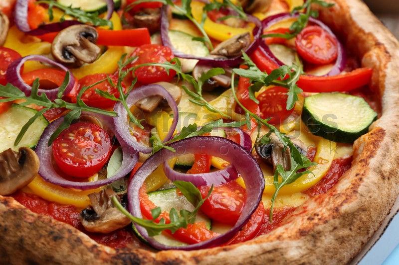 Photo of Delicious hot vegetable pizza with mushrooms, closeup