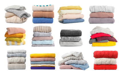 Set of folded and stacked sweaters on white background