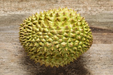 Ripe durian on wooden table, top view