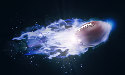 Rugby ball with bright flame flying on black background