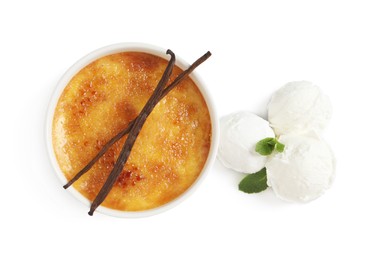 Delicious creme brulee with vanilla sticks, scoops of ice cream and mint on white background, top view
