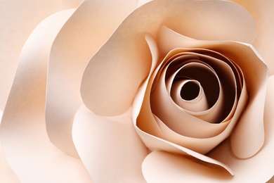 Photo of Beautiful beige flower made of paper as background, top view