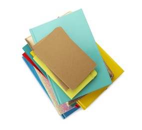 Stack of different colorful hardcover planners on white background, top view