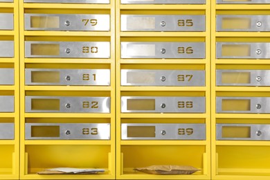 Metal mailboxes with keyholes, numbers and correspondence in post office