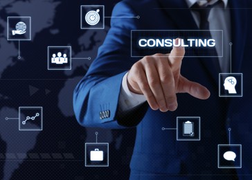Man pointing at word CONSULTING on virtual screen, closeup