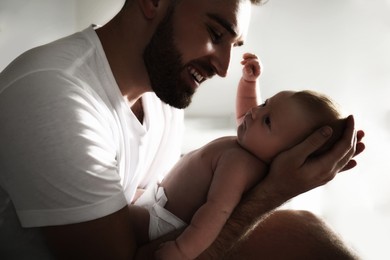 Father with his newborn baby at home