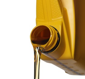 Man pouring motor oil from yellow container on white background, closeup