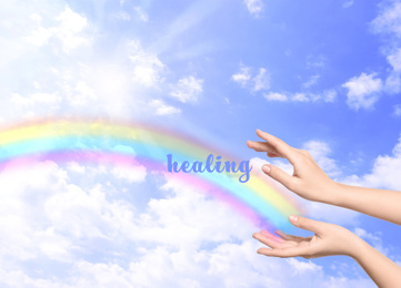Woman and rainbow as source of healing energy on sunny day, closeup
