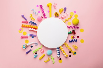 Flat lay composition with carnival items and blank card on pink background. Space for text