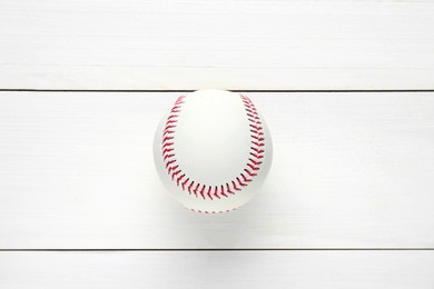 Photo of Baseball ball on white wooden table, top view. Sports game