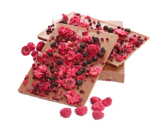 Chocolate bars with freeze dried berries on white background
