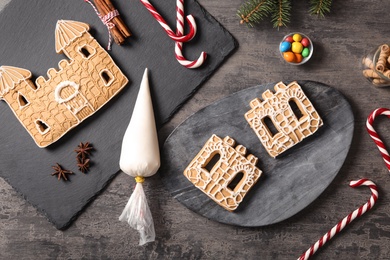 Flat lay composition with parts of gingerbread house on grey table