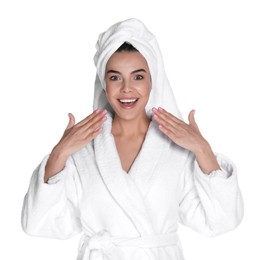 Photo of Beautiful young woman wearing bathrobe and towel on head against white background