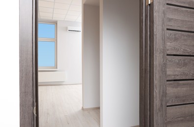 Empty office room with white walls and door. Interior design