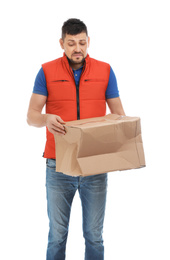 Emotional courier with damaged cardboard box on white background. Poor quality delivery service