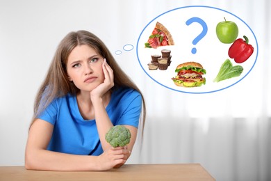 Woman with broccoli thinking about what to chose - healthy and unhealthy food at table indoors