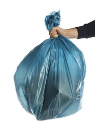 Man holding trash bag filled with garbage on white background, closeup