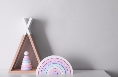 Cute toys on table, space for text. Interior design