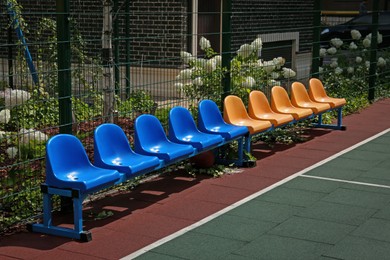 Empty chairs on outdoor children's playground in residential area