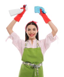 Young housewife with detergent and rug on white background