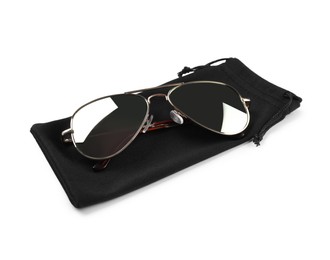 Modern sunglasses with black cloth bag on white background