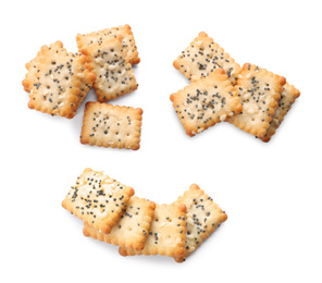 Set of tasty crispy crackers with poppy and sesame seeds on white background, top view