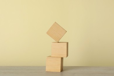 Stack of wooden cubes on table. Harmony and balance concept