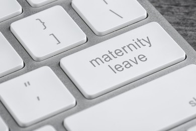 Modern computer keyboard with text MATERNITY LEAVE, closeup