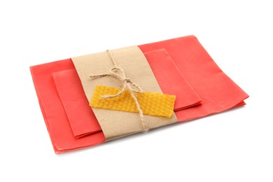 Reusable beeswax food wraps on white background