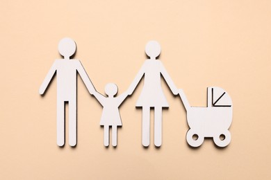 Figures of family on beige background, top view. Insurance concept