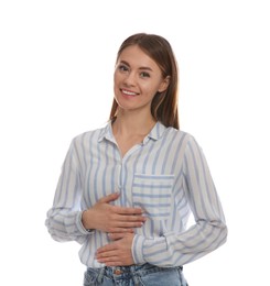 Healthy woman holding hands on belly against white background