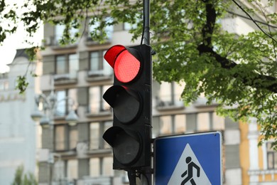 Photo of View of traffic light in city on spring day