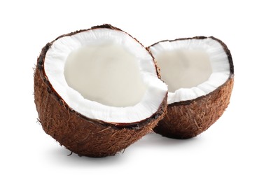 Halves of fresh ripe coconut on white background