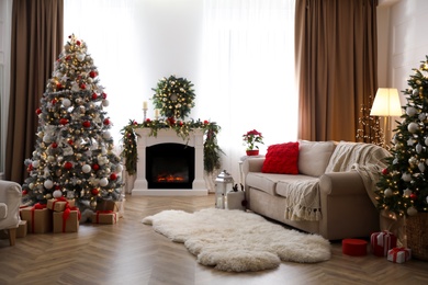 Festive living room interior with Christmas trees and fireplace