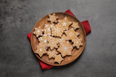 Tasty Christmas cookies on grey table, top view