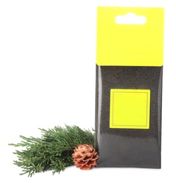 Scented sachet, pine cone and fir branch on white background